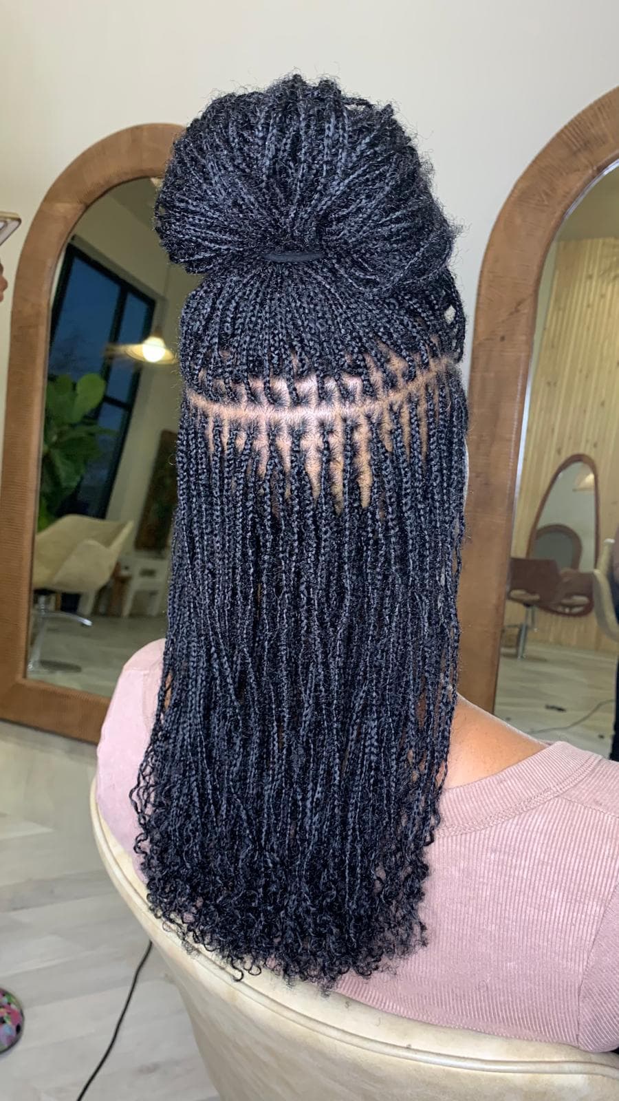 Woman with beautifully styled microlocs